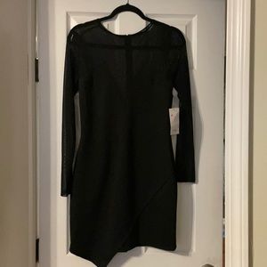 New with tags Toni long sleeve black dress. Netting throughout chest and arms.